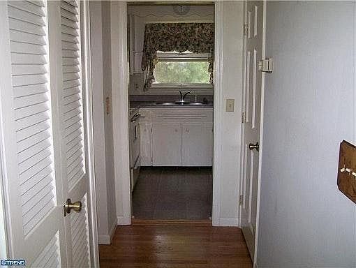 As you walk in the front door you find a double door closet
