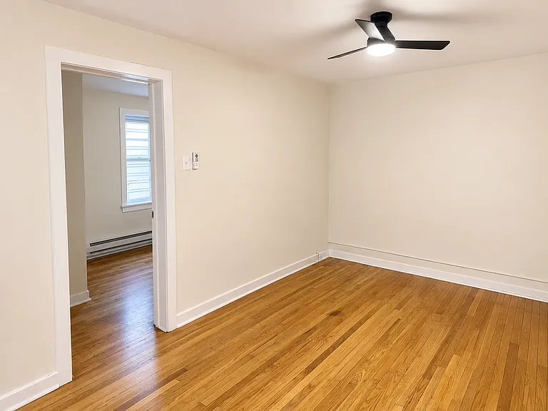 view of living area and doorway to second bedroom
