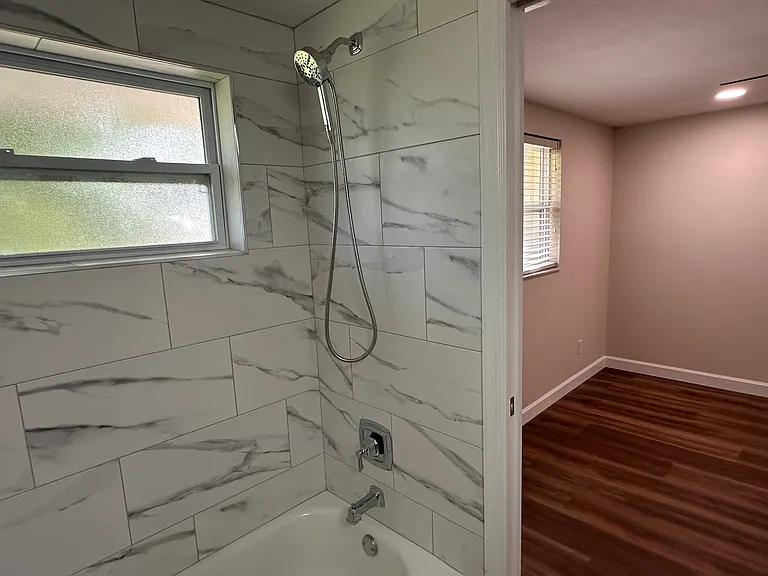 First bedroom has it's own bathroom with shower/tub combo