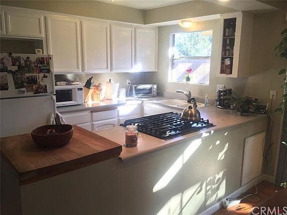 Kitchen with butcher block area and gas range