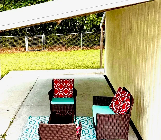 Outdoor patio and fully fenced backyard