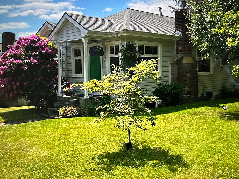 The house in May with rhododendron in full bloom