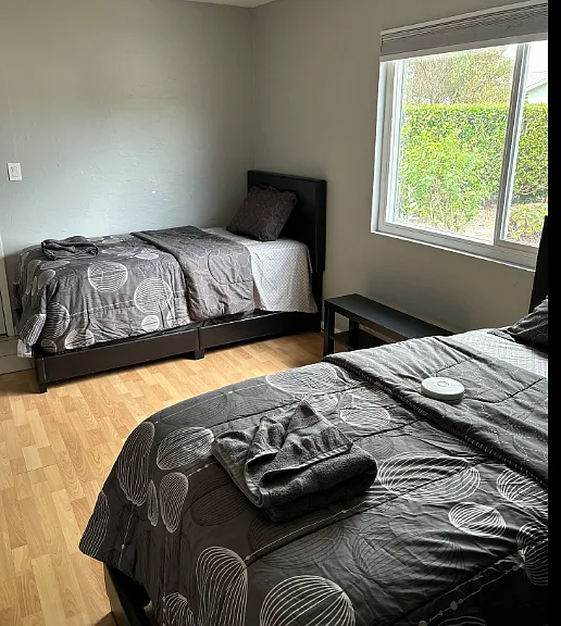 Large double room setup with twin beds but can also be changed to queen bed as needed
