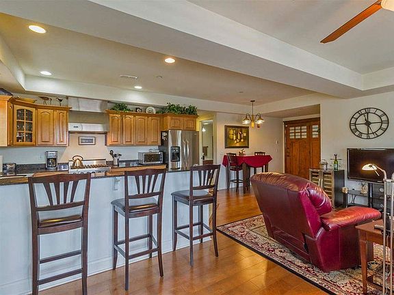 Kitchen, living room with front door in back