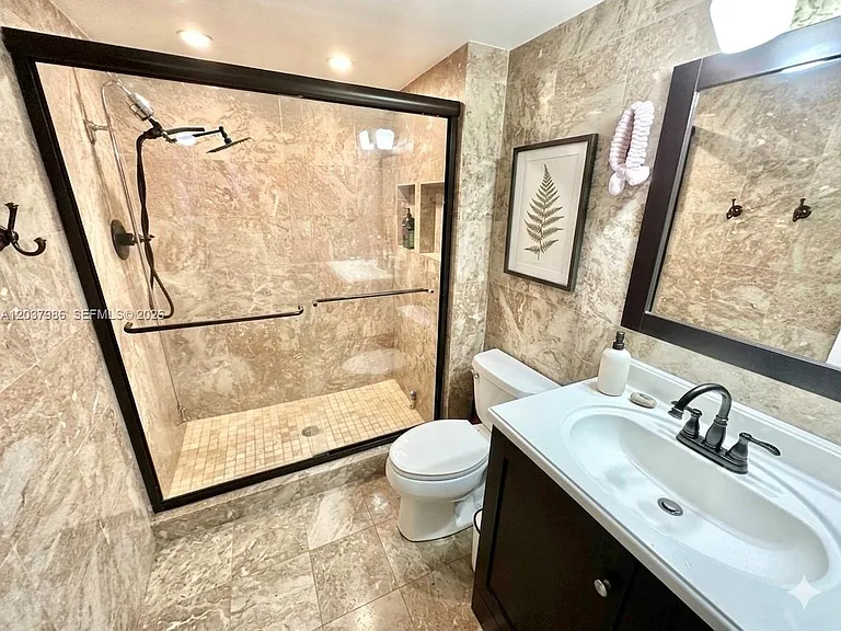 8955 Wiles Rd #208 — Photo 9