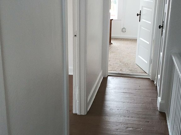 Hall into master bedroom. Two other bedrooms on your left