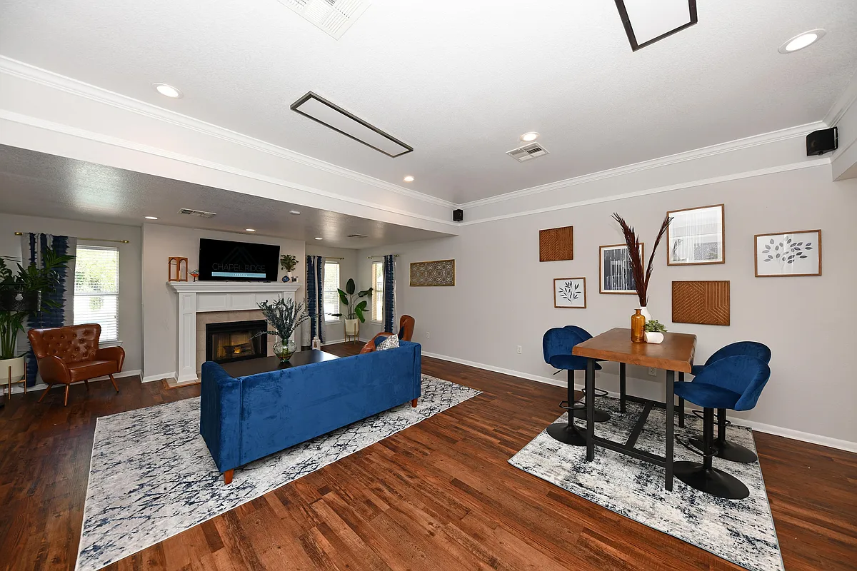 Explore the sophistication of this chic living room, ideal for stylish relaxation and entertaining. - Chapel Ridge Jackson
