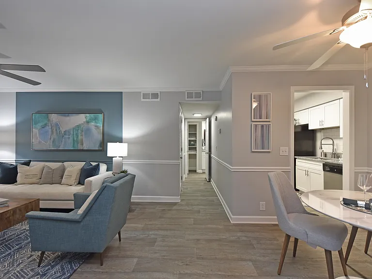 Living room and dining area with hardwood-style flooring