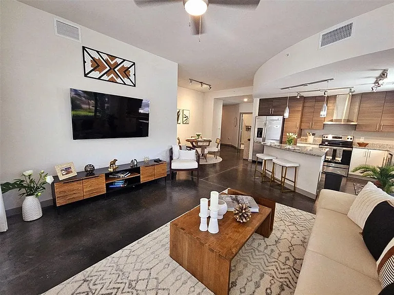 Enjoy seamless flow between your living room and kitchen, where open space creates a perfect setting for both relaxation and entertaining.