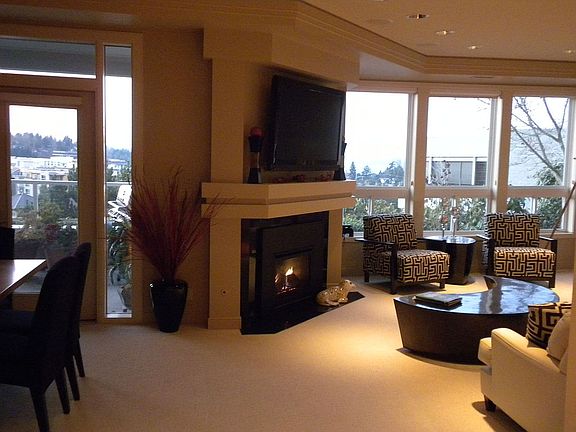 Light filled sophisticated living w gas fireplace and opens to private garden 