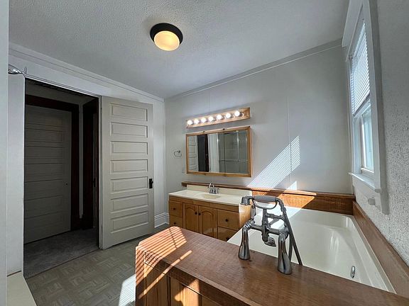 Upstairs bathroom with soaking tub and standing shower
