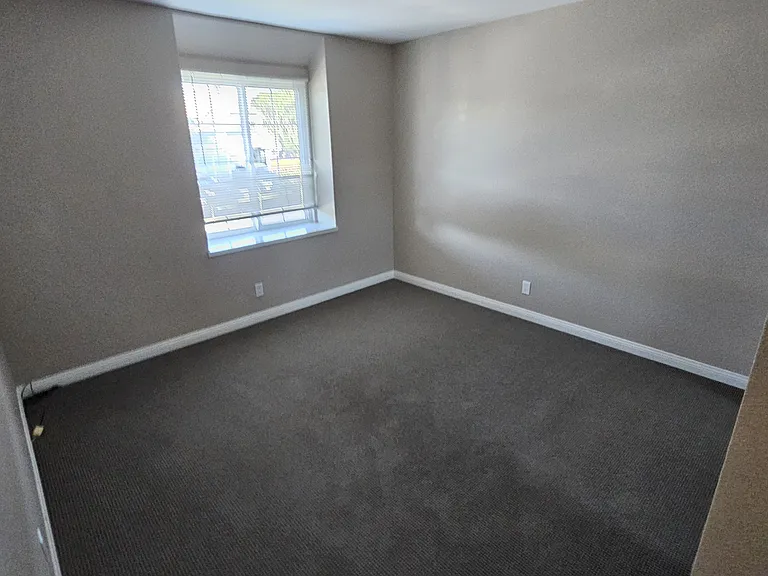 Guest Bedroom. One window bigger of the two.