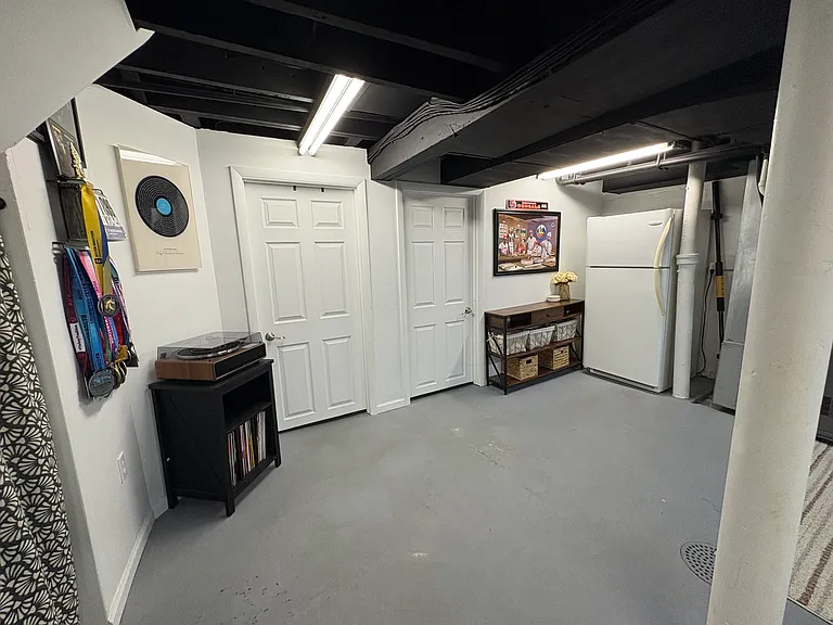 Basement doors to laundry room/bathroom and storage/spare room