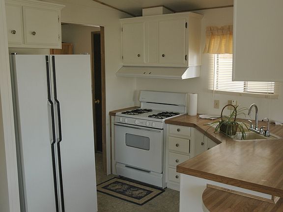This Kitchen is waiting for you with a New Stove.