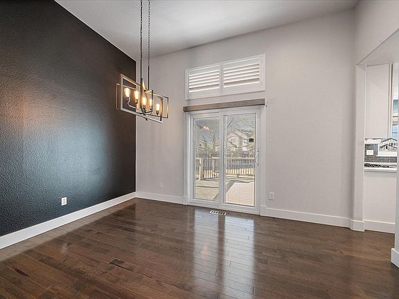Wood Floors, Sliding glass door with blinds in the glass.
