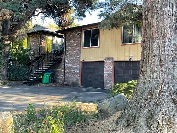 Surrounded by a huge Redwood and other pines on the street side and a sunny backyard in the south side.