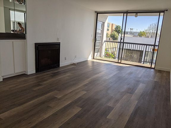 Gorgeous living room with open floor plan to large balcony.