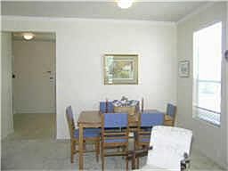 Dining room also has crown molding. Plenty of windows let the sunshine in.