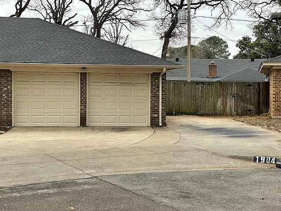 Extra parking pad on side of house