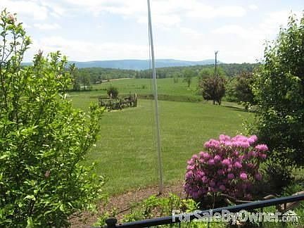 Standing on front covered porch
						:
						Looking East