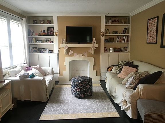 Living room with fireplace and built in bookcases