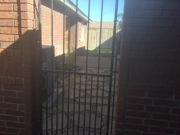 Gated entry to side yard