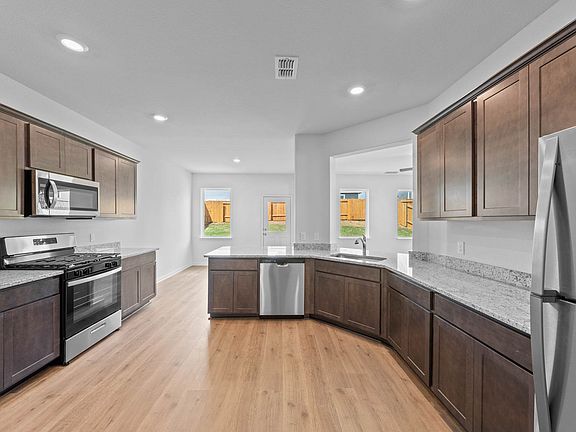 The kitchen has sprawling granite countertops.