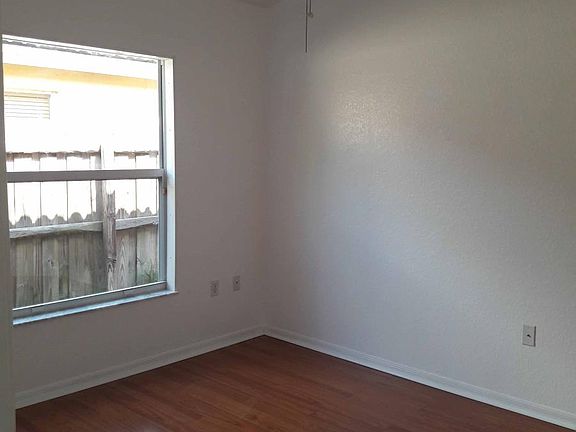 Bedroom 1. Synthetic wood floor. Ceiling fan. LED can ceiling lights.