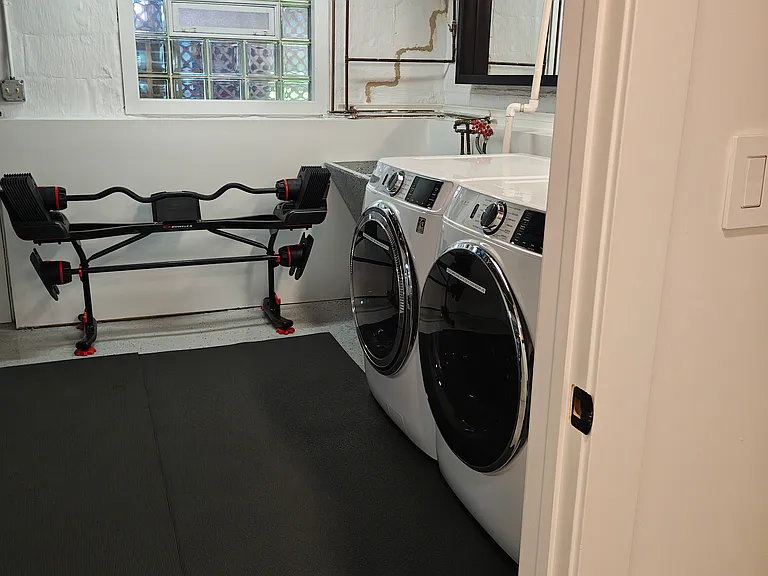 Full size washer/dryer just outside your bathroom door. Only shared with one other unit. Free to use. There's also a workout area.