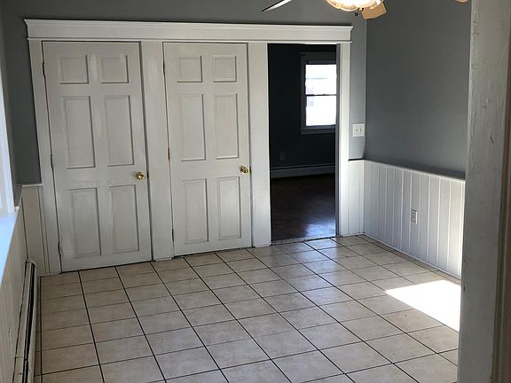 Dining room. Standing in entry door. Bathroom behind me. First door is dining room closet. Second is door to basement. Open door way leads to living room.