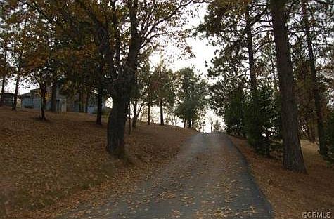 The paved driveway leads to the home.