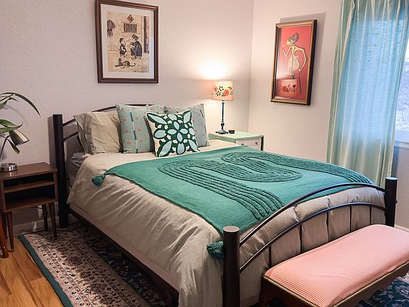 Master bedroom with walk-in closet and built in office area