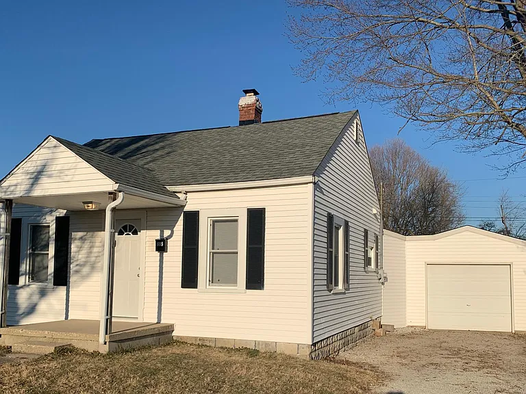 The laundry/utility area is connected to the garage, which has an opener.