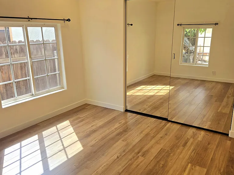 Bedroom 1 - new paint, new floors, new closet doors, new light fixture. 
ALL NEW AND CLEAN.