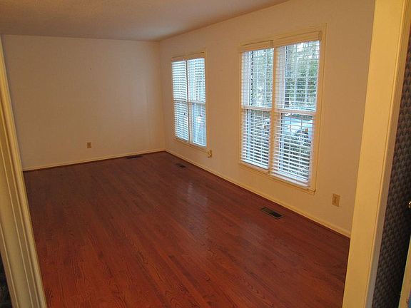 Living Room with large windows and hardwoods