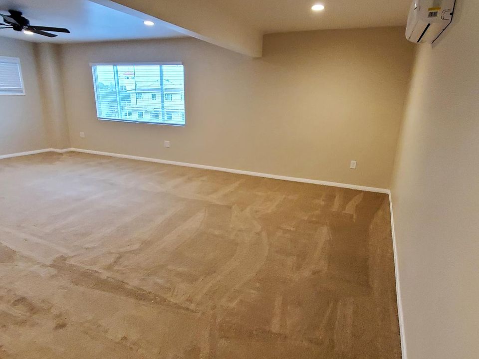 Extra large living and dining rooms open to the kitchen.