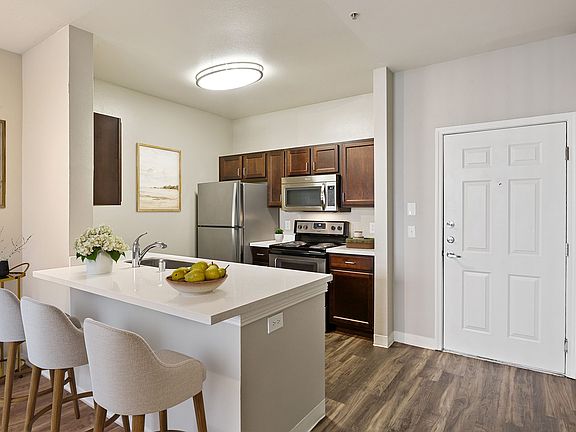 Prepare meals in a kitchen that combines modern design with practical functionality.