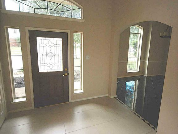 Grand 2 story entry with upgrading lighting.