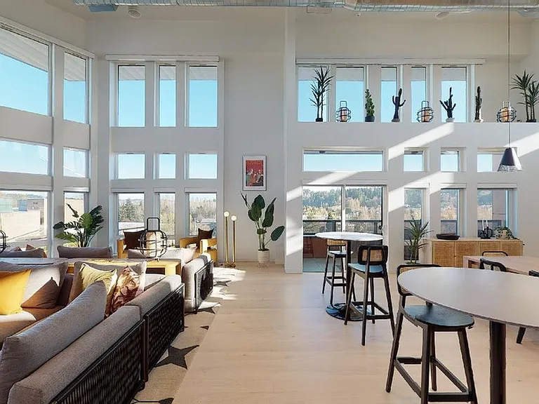 Relax in the Sky Lounge with large HDTV, kitchen and workspace