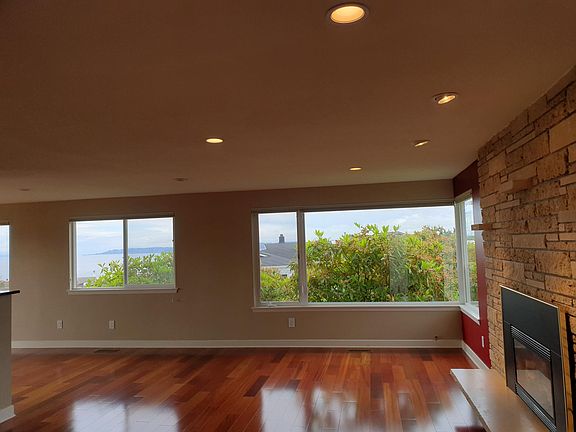 Stunning Sound views throughout living & dining area.