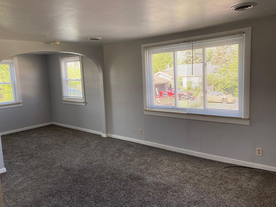 Newer carpet and ample natural lighting throughout creates a cozy environment in the living area and bedroom.