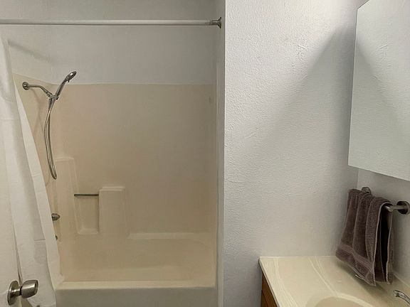 Bathroom with full tub.
