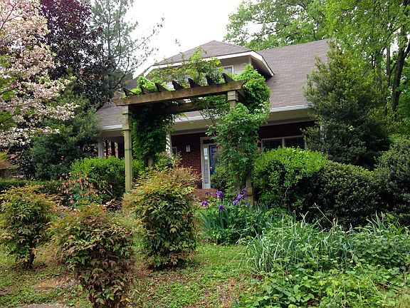 Arbor and mature landscaping