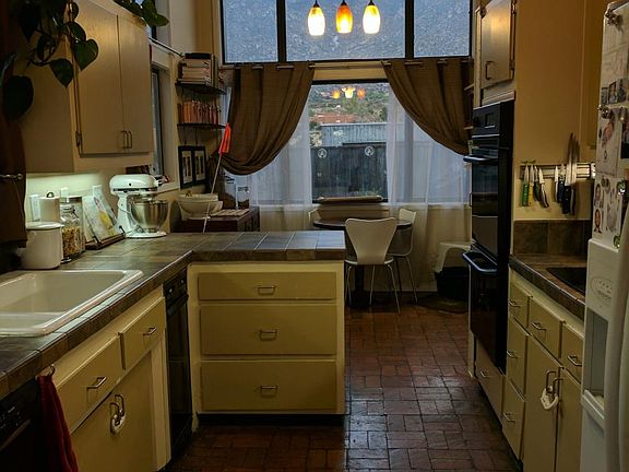 Custom kitchen, breakfast nook, and views