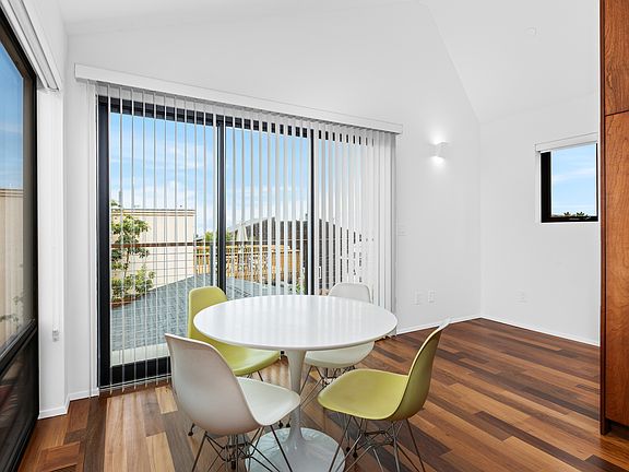 Dining area and desk nook with a wrap around patio.
