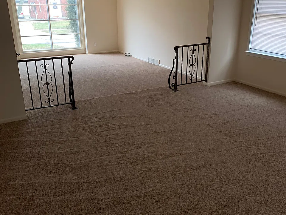 Living room and dining room shown from the kitchen doorway