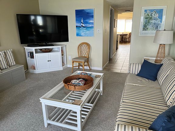 This picture shows the large television in the Living room. This unit has Direct TV and Wi-Fi in the Living room and downstairs bedroom.