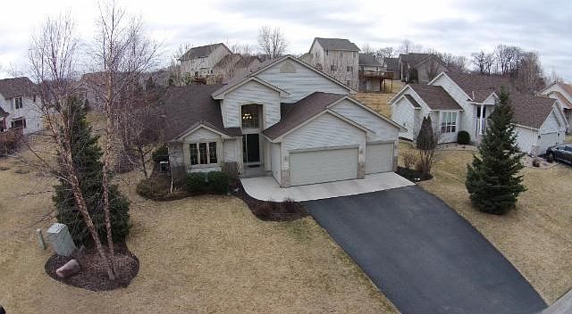 The view of the front of the home captures some of the mature landscaping.  Additionally, the three stall garage is insulated.