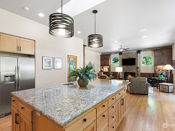 One of the great views of the "Heart of This Home".  Wonderful prep island and family room beyond.>