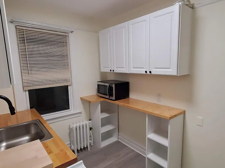All the kitchen counters and cabinets, counters, and the sink are brand new. The stove/oven is gas.